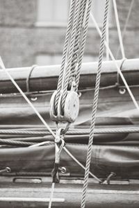Close-up of rope tied on pulley of nautical vessel