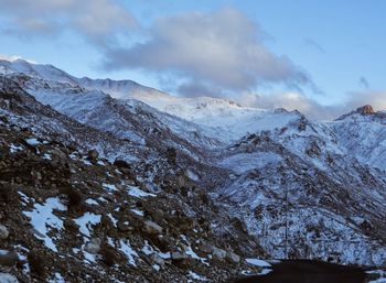 Scenic view of snowcapped mountains against sky