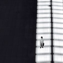 High angle view of teenage boy standing on street