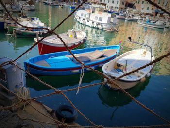 Boats moored at harbor