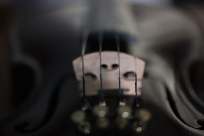 Close-up of guitar in darkroom