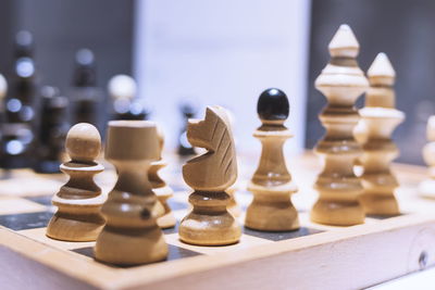 Close-up of chess pieces on board