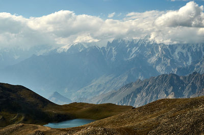 Scenic view of snowcapped mountains against sky