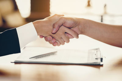 Close-up of hand holding ice cream