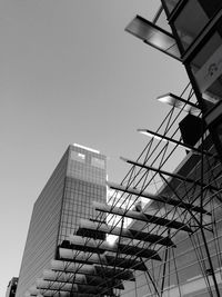 Low angle view of modern buildings against clear sky