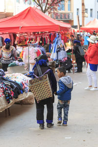 People walking on street market