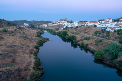 View of the alentejo town of mértola with the guadiana river in evidence.