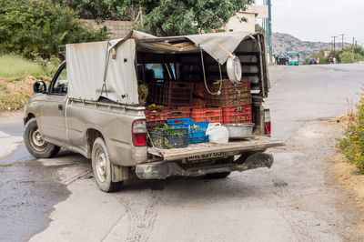 Vehicles on road against buildings in city