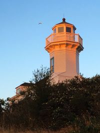 Low angle view of lighthouse against clear sky