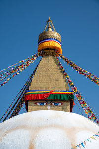 Low angle view of traditional building against blue sky