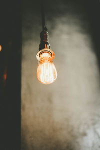 Low angle view of illuminated light bulb