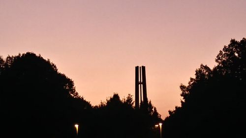 Low angle view of silhouette trees against sky during sunset