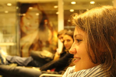 Close-up of young woman at airport lobby