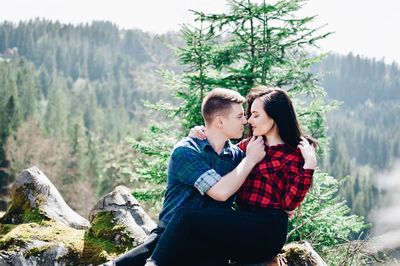 Loving young couple in forest