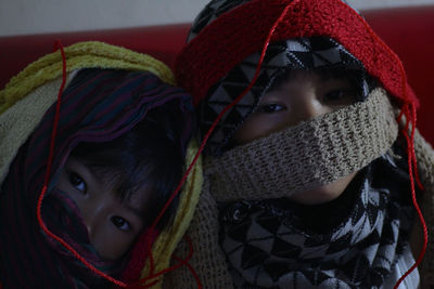 Portrait of children with woolen scarf