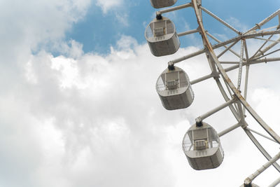 Low angle view of ferris wheel against sky