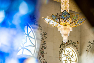 Low angle view of illuminated chandelier