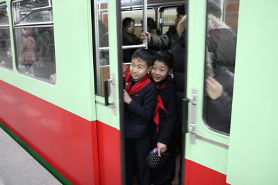 Reflection of people on train at subway station