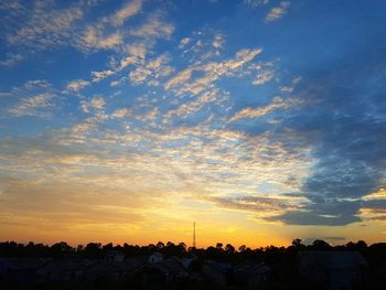 Low angle view of silhouette trees against sky during sunset