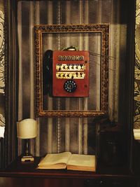 Close-up of telephone booth on table