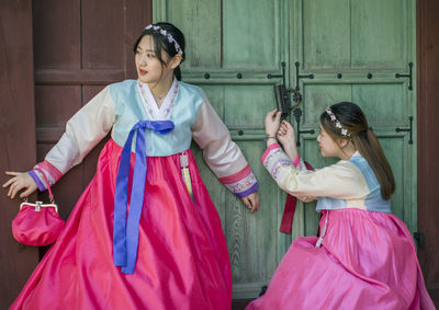 Women standing at doorway