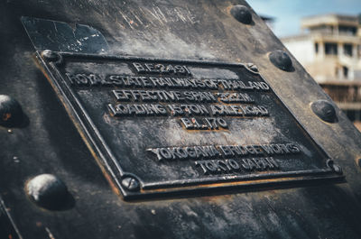 High angle view of text on old metal