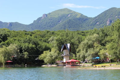 Scenic view of river with mountain in background