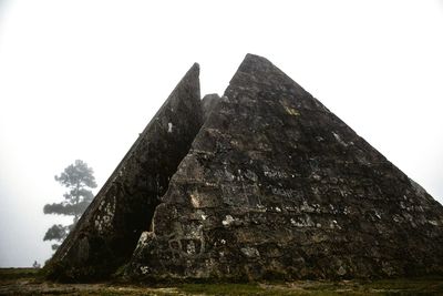 Low angle view of old ruin against clear sky