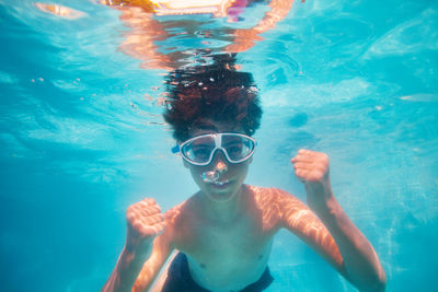 Portrait of woman swimming in sea