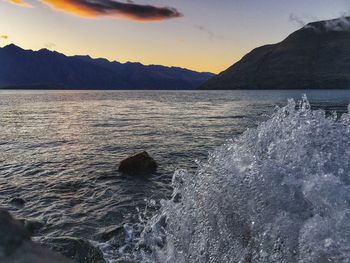 Scenic view of sea against sky at sunset