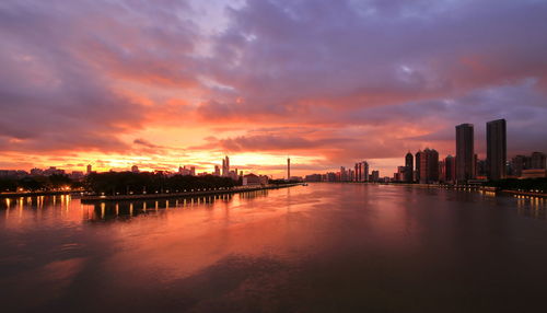 Scenic view of pearl river against cloudy sky during sunset