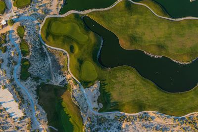 Aerial view golf club surrounded by wetland in sesera, sport ,green landscape, hotel and real estate