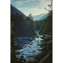 Scenic view of river and mountains