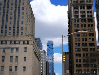 Low angle view of buildings in city against sky