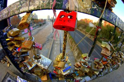 Love padlocks on railing over street