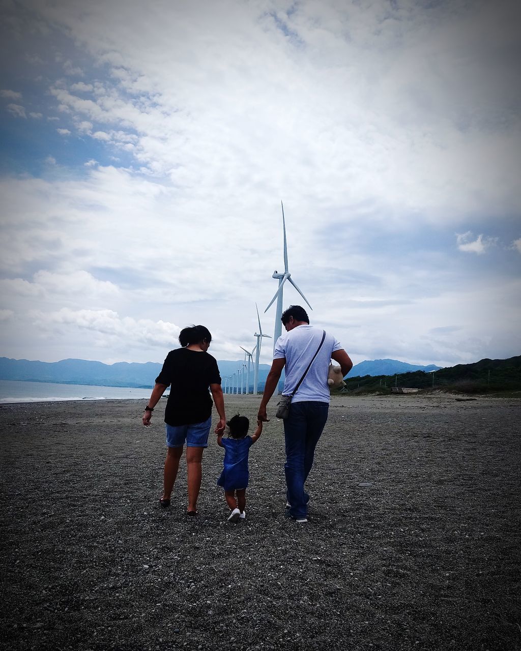 sky, cloud - sky, real people, full length, rear view, land, women, lifestyles, men, togetherness, nature, people, field, group of people, leisure activity, day, adult, casual clothing, child, walking, outdoors, sister