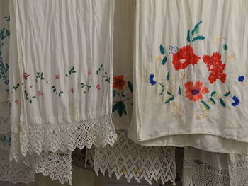 Close-up of clothes hanging against wall