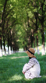 Rear view of woman standing in park