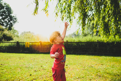 Boy standing on field