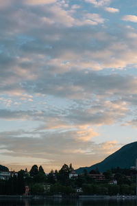 Scenic view of buildings against sky during sunset