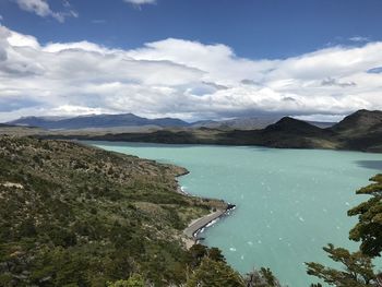 Scenic view of lake and mountains against sky