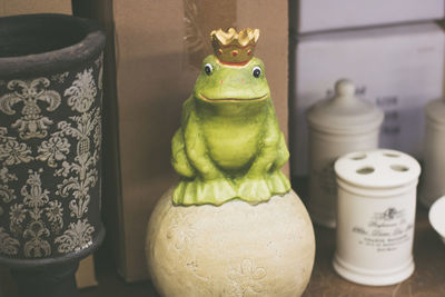 Close-up of frog on table