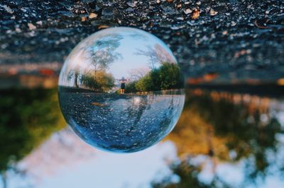 Close-up of crystal ball on glass