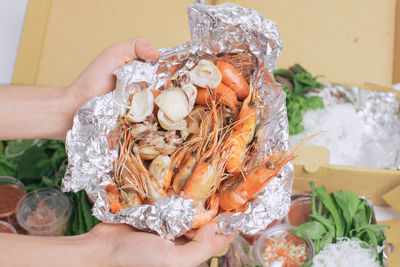 High angle view of hand holding ice cream