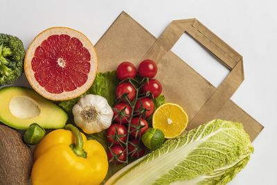 Directly above shot of various fruits on white background