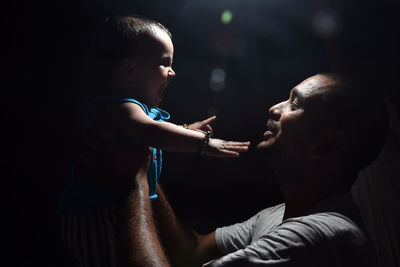 Side view of father with daughter