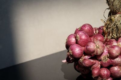 Close-up of strawberries on table against wall