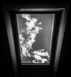 Low angle view of building against cloudy sky