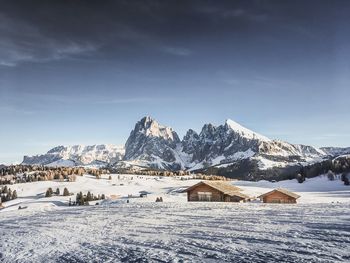 Scenic view of snowcapped mountains against sky