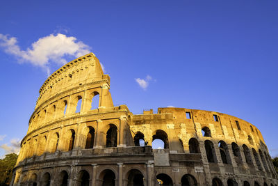 Colosseum at sunset - oval roman amphitheatre ruins - rome, italy